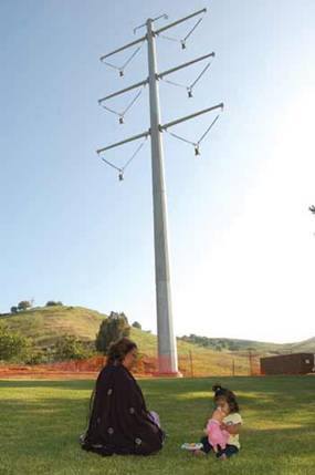 Mother and child in a park under a 185-ft transmission tower in Chino Hills, CA